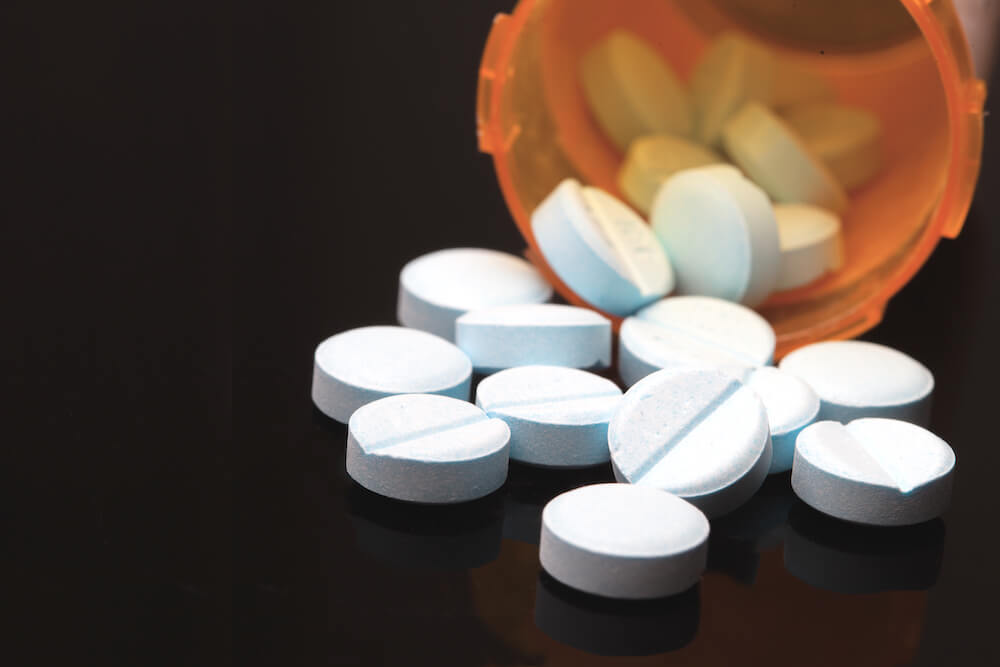 pill bottle showing spilled pills for Opioid Epidemic